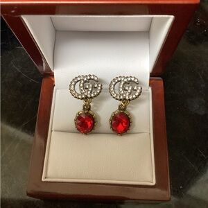 Red and antique gold earrings.